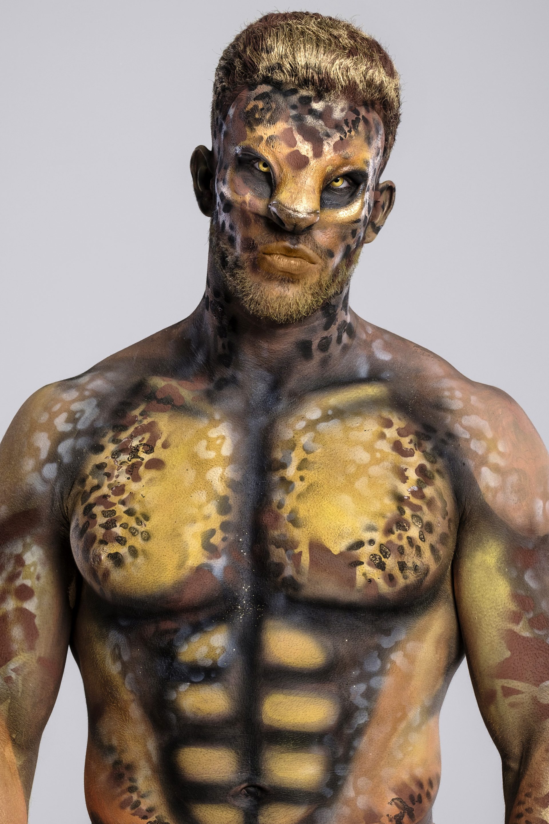 Circus animal body painted models male muscle leopard cat