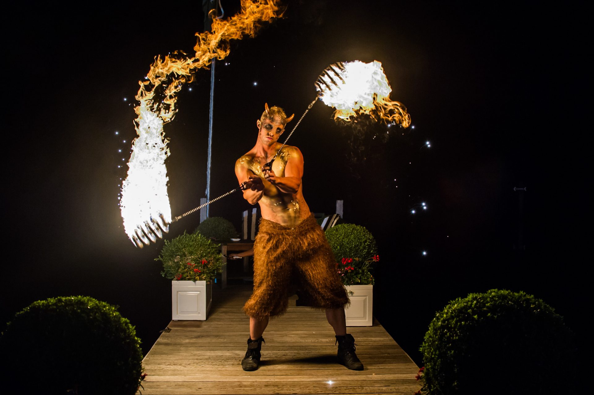 Fire breathing puck faun performer act for party event garden party ideas