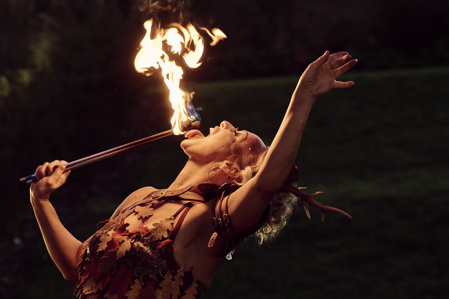 Bambi Firebreathing Faun Photo of a fire breathing circus performer at dusk dressed as a faun