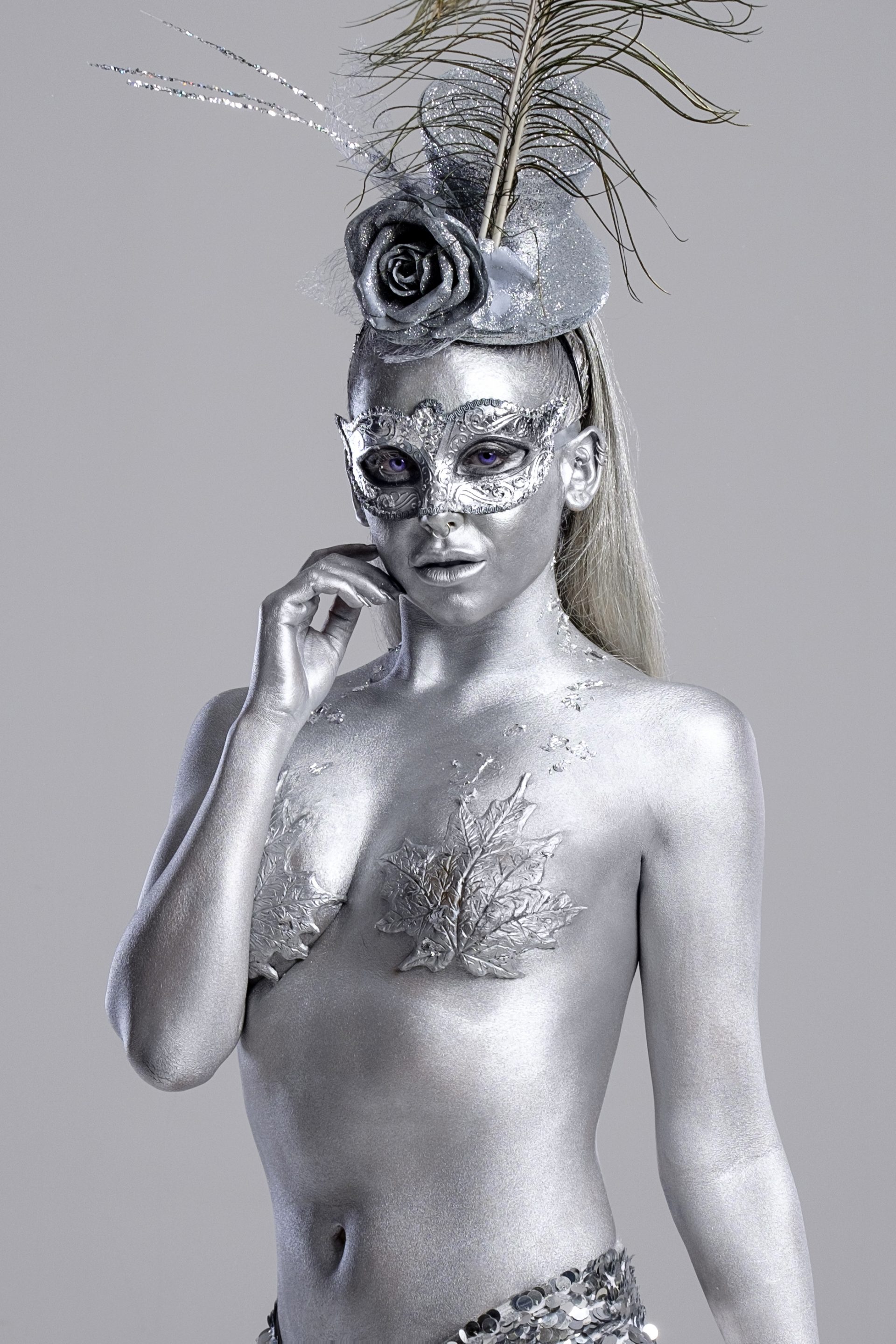Narnia Winter Wonderland Christmas Party Narnia Winter Wonderland Christmas Party female model dancer body painted silver Christmas entertainment circus performer fire breather