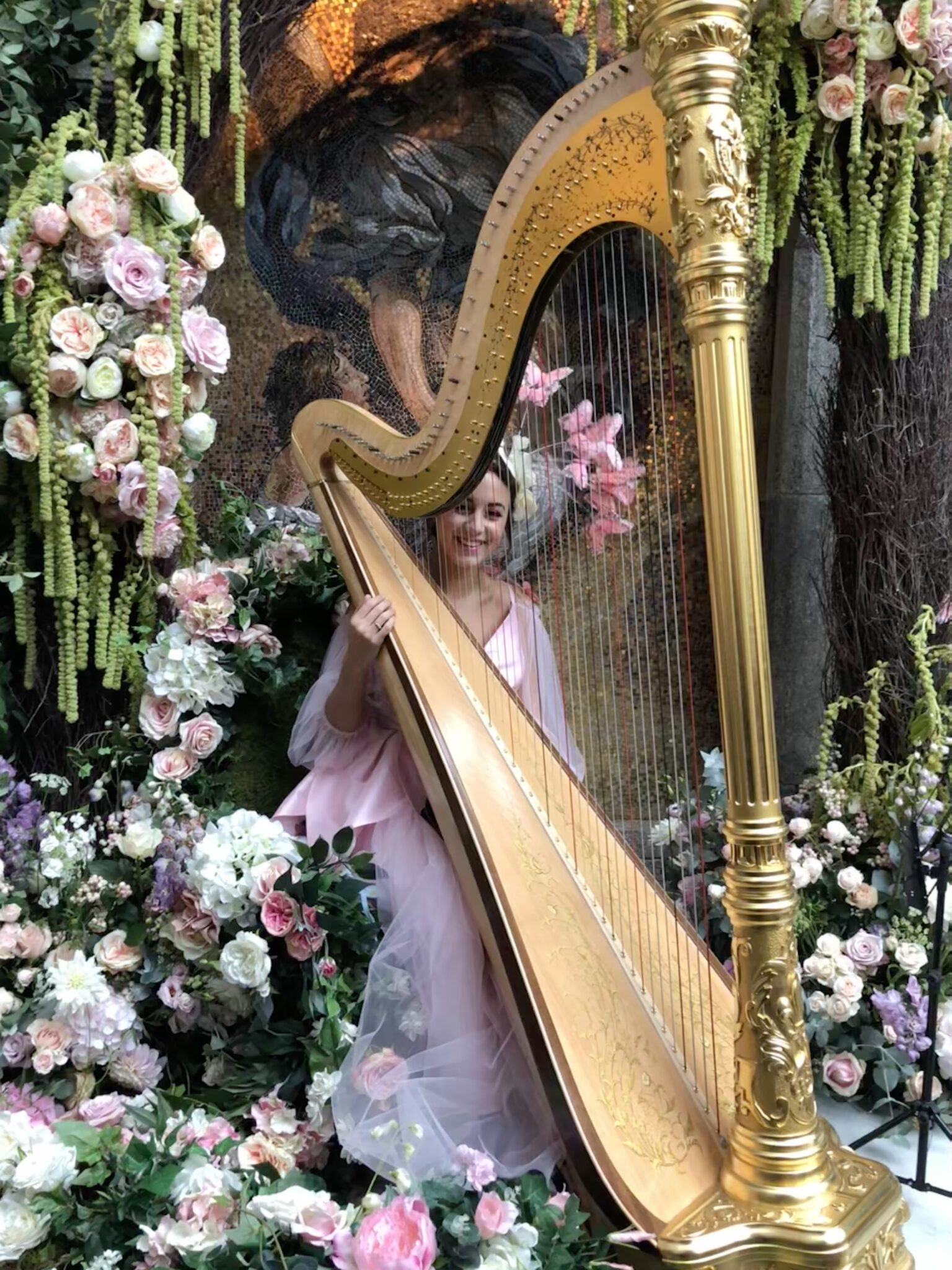 Fairy Harpist at Annabels A fairy harpist produced for Annabels mayfair. She is sitting on a stage with a giant golden harp