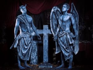 body painted angel and devil statue
