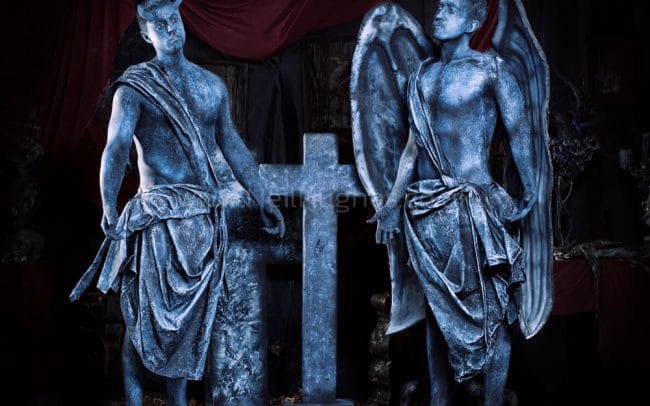 body painted angel and devil statue