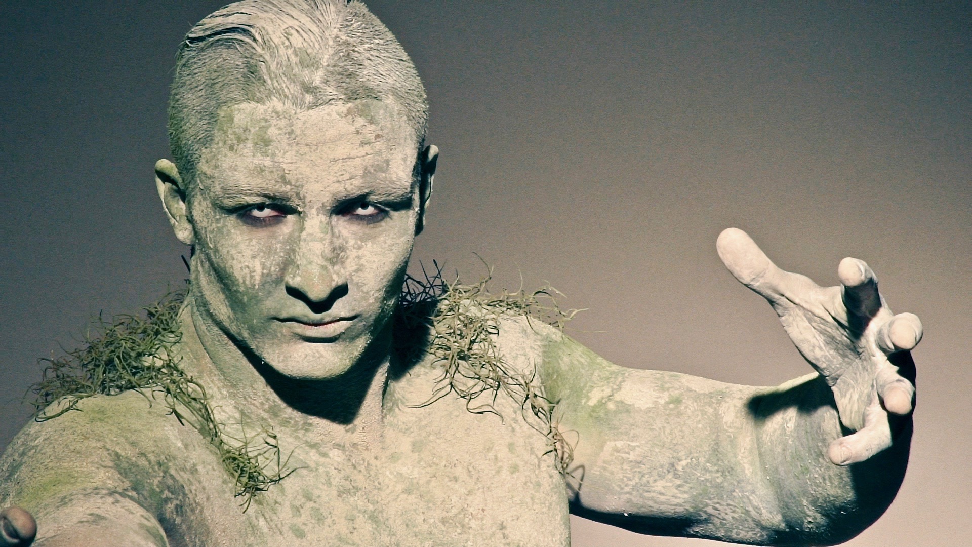 Living Statue A body painted male physique model as a stone statue