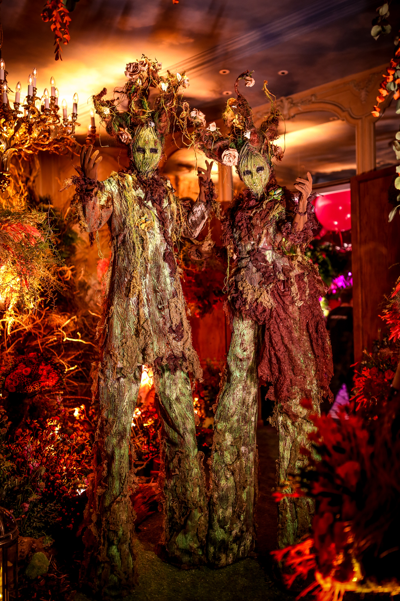 Oberon and Titania Stilt Walking Trees Two stilt walking living tree costumes at an enchanted garden party