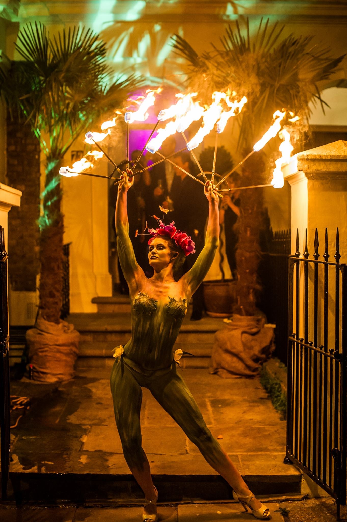 Body Painted Orchid Fire Performer Woman body painted as a flower fire breathing
