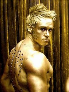 Sexy golden body painted model muscle